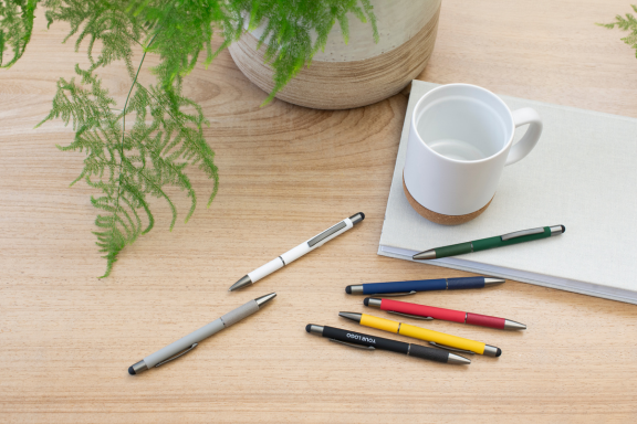 pens, mug, plant, writing bloc